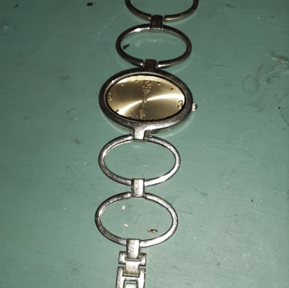 Watch silver rings as wrist.